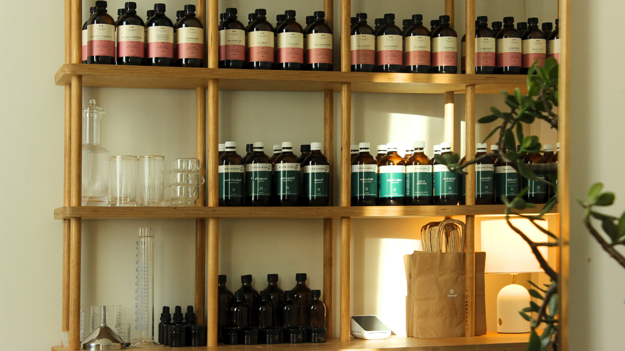 Microbiome Rewilding Naturopath Clinic Brisbane Australia Online Appointments Personalised holistic health for women Naturopath Dispensary Shelves with various herbal medicine bottles and skincare containers in a well-lit room